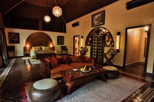 Luxury Suite, Garden View | Bathroom | Bathrobes, slippers