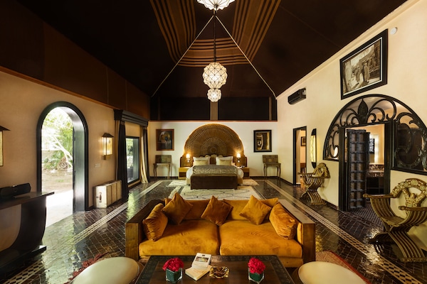 Luxury Suite, Garden View | Hypo-allergenic bedding available, memory foam beds, in-room safe