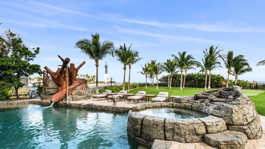 Luxurious 3-story Estate With Gym Pool Slide Private Beach and Lighthouse Views