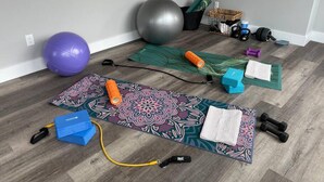 A room with a patterned exercise mat, a yoga ball, a stability ball, and various fitness equipment. - High-tech Mountain Luxury Fitness Hot Tub BBQ (The Blue Mountains)
