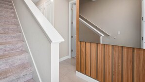 A staircase with a white handrail and carpeted steps leading to a door. - Super Close- Disney s Parks w Theme Rooms Pool (Lake Buena Vista)