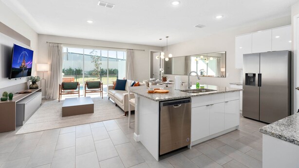 A modern kitchen with a central island, built-in appliances, and a large window offering a view. - Super Close- Disney s Parks w Theme Rooms Pool (Lake Buena Vista)