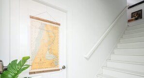 A white door with a map of Saugatuck Harbor, Michigan.