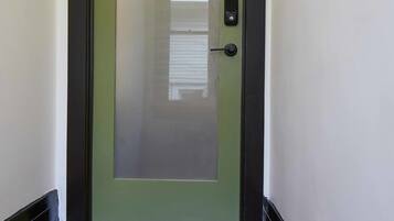 A door with a frosted glass panel and a number '2' on the door frame.