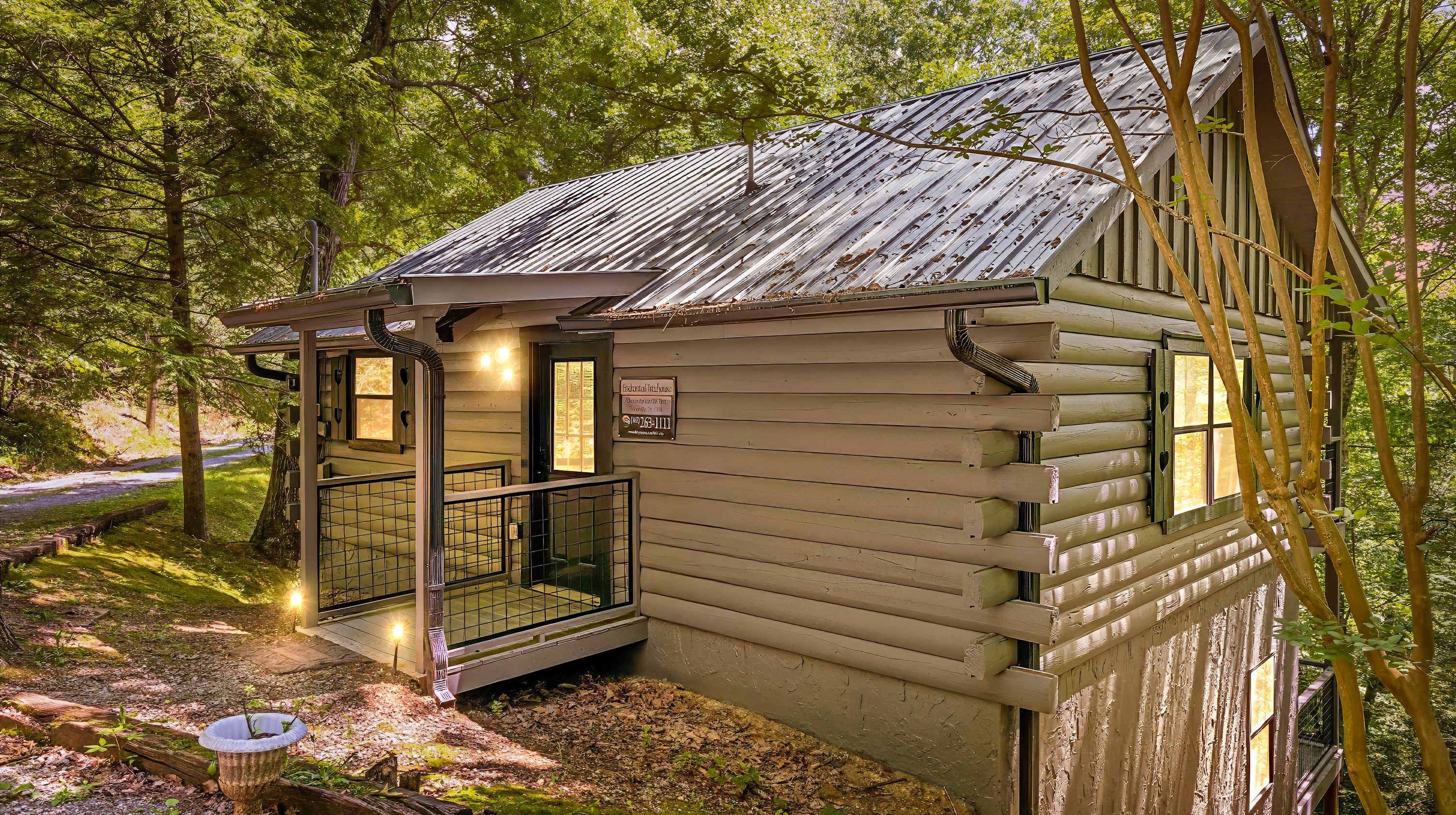A rustic cabin with a metal roof, a small porch, and a sign indicating a private property.