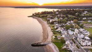 An aerial view of a coastal residential area with houses along the shoreline and a pier extending into the water. - Stareway to Heaven in Fairfield (Fairfield)