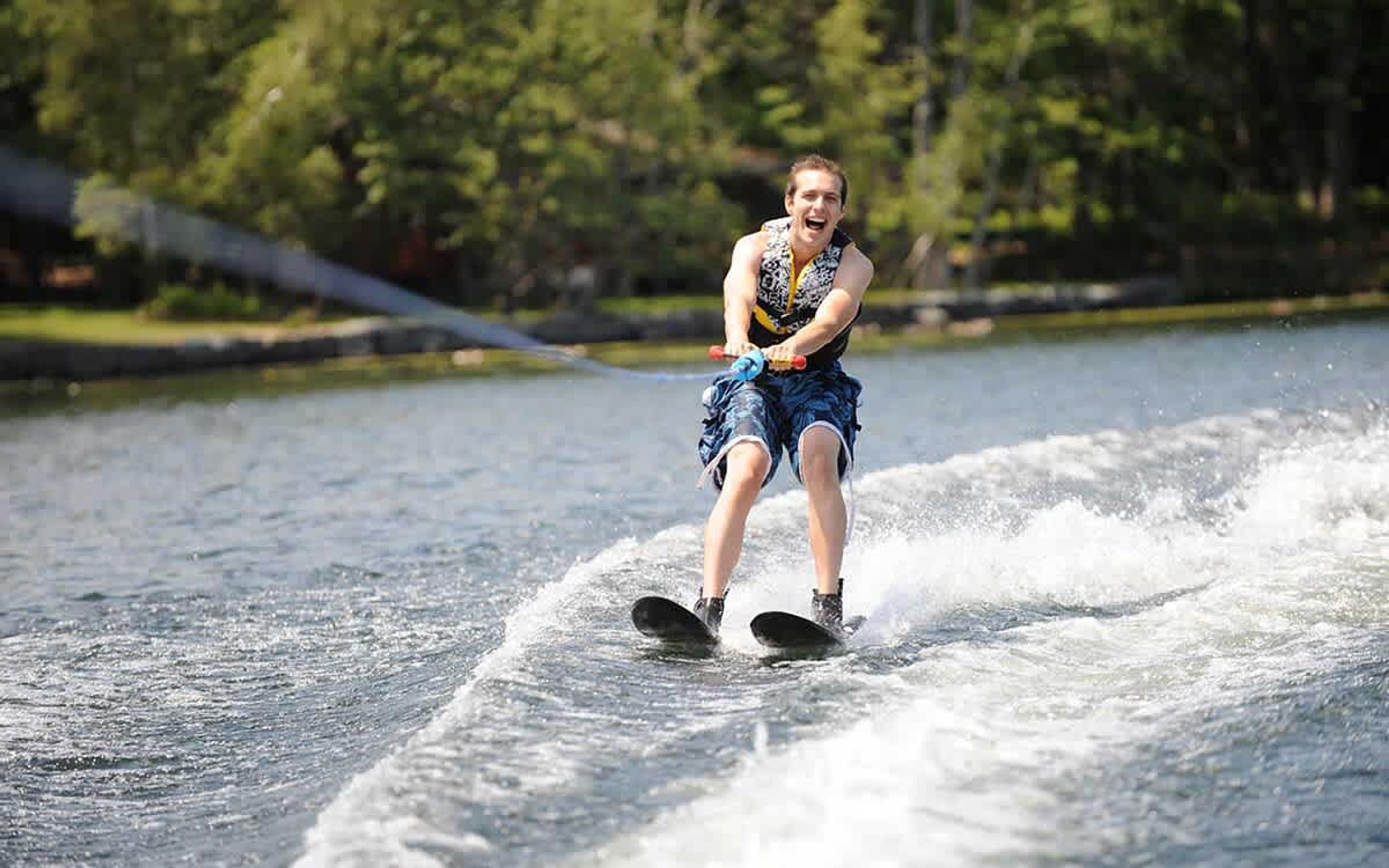 A person wakeboarding on a body of water.