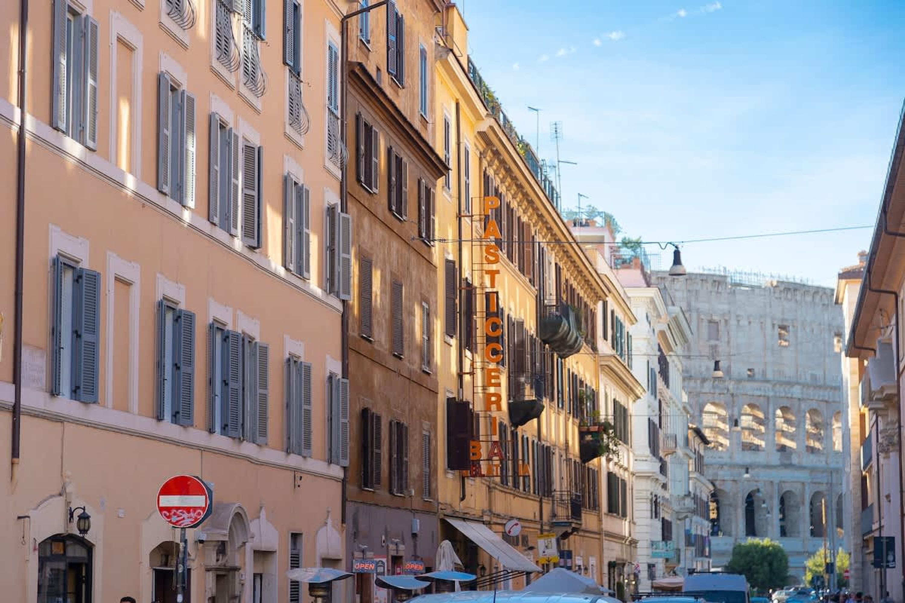 A street view with a building labeled "PASTICCERA" and a "No Entry" sign.