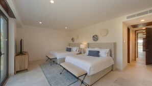 A hotel room with two beds, a bench, a small table, and a TV. - Encanto 822 by Owner Luxury Sunset Getaway Punta Mita (Punta de Mita)