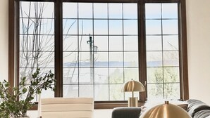 A modern living room with a sofa, armchair, coffee table, and a lamp. - Coastal Haven Seaside Serenity Retreat (Federal Way)