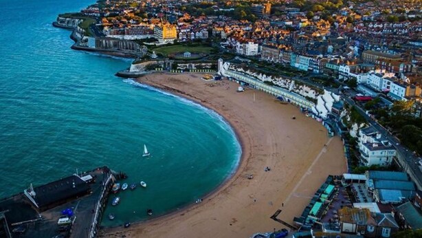 An aerial view of a coastal town with a beach, a promenade, and a mix of residential and commercial buildings. - Luxury Ocean North Foreland Golf View By Adliv (Broadstairs)