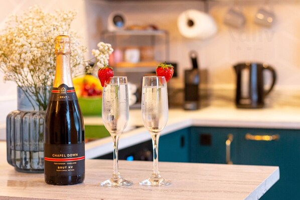 A bottle of 'Chapel Down' champagne and two glasses on a wooden surface. - Old Town Trinity Apt No 4 By Adliv (Margate)