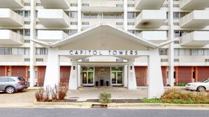 A multi-story building with a prominent entrance labeled "Capitol Towers." - Travel Professionals Downtown (Nashville)