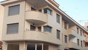 A multi-story building with balconies, large windows, and a no entry sign. - La Mar 2 in El Campello (El Campello)