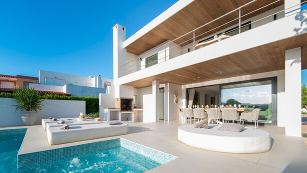 A modern house with a swimming pool, outdoor seating, and a dining area. - Can Palau in Santa Eul ria des Riu (Santa Eulalia del Rio)