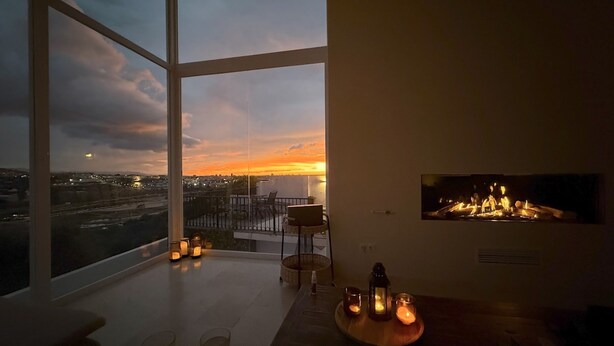 A modern interior with large windows, a balcony, and a fireplace. - Casa Kodak - Las Lagunas de Mijas (Mijas)