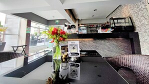 A modern hotel lobby with a reception desk, seating area, and a bar. - The Polanco Signature Curated 2BR w Top Amenities (Mexico City)