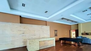 A spacious lobby with a reception desk, a pool table, and a seating area. - The Polanco Signature Curated 2BR w Top Amenities (Mexico City)