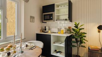 Fridge, microwave, coffee/tea maker, toaster