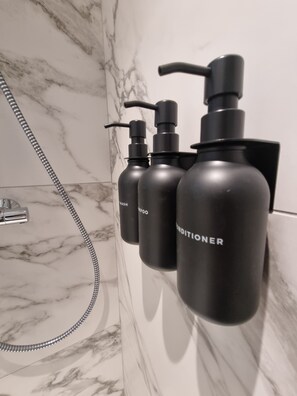 Shower, hair dryer, towels, soap