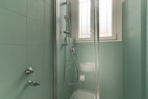 Shower, hair dryer, towels, toilet paper