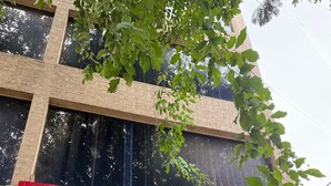 A building with a sign that reads "SLR RESIDENCY" in English and another language. - SLR Residency (Bengaluru)