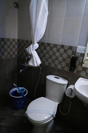 Basic Studio | Bathroom | Shower, slippers, towels, soap - SLR Residency (Bengaluru)