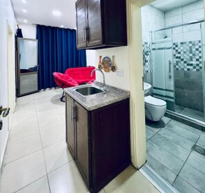 Shower, hair dryer, towels, soap