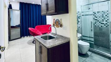 Shower, hair dryer, towels, soap