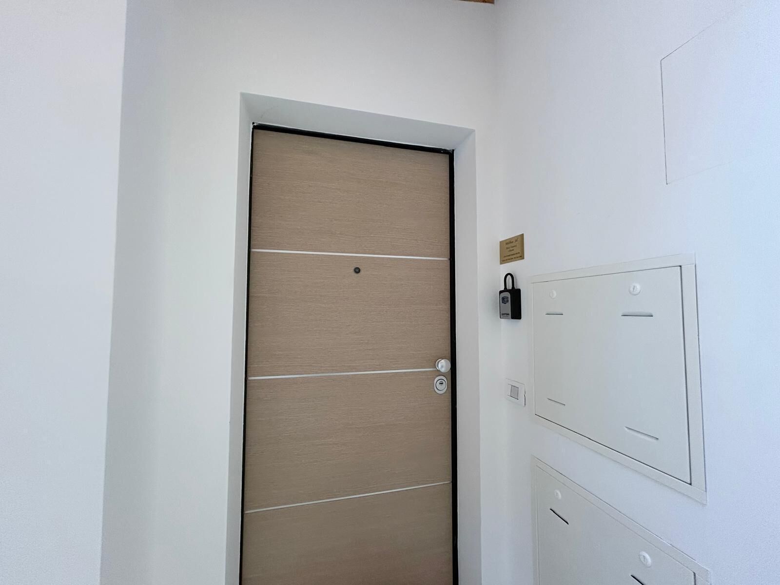 A door with a horizontal panel design, a lock, and a keyhole.