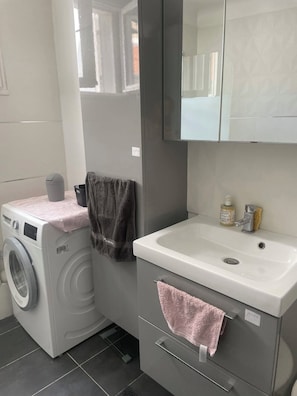 Hair dryer, towels, soap, toilet paper