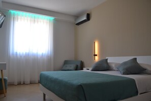 1 bedroom, desk, iron/ironing board, travel crib