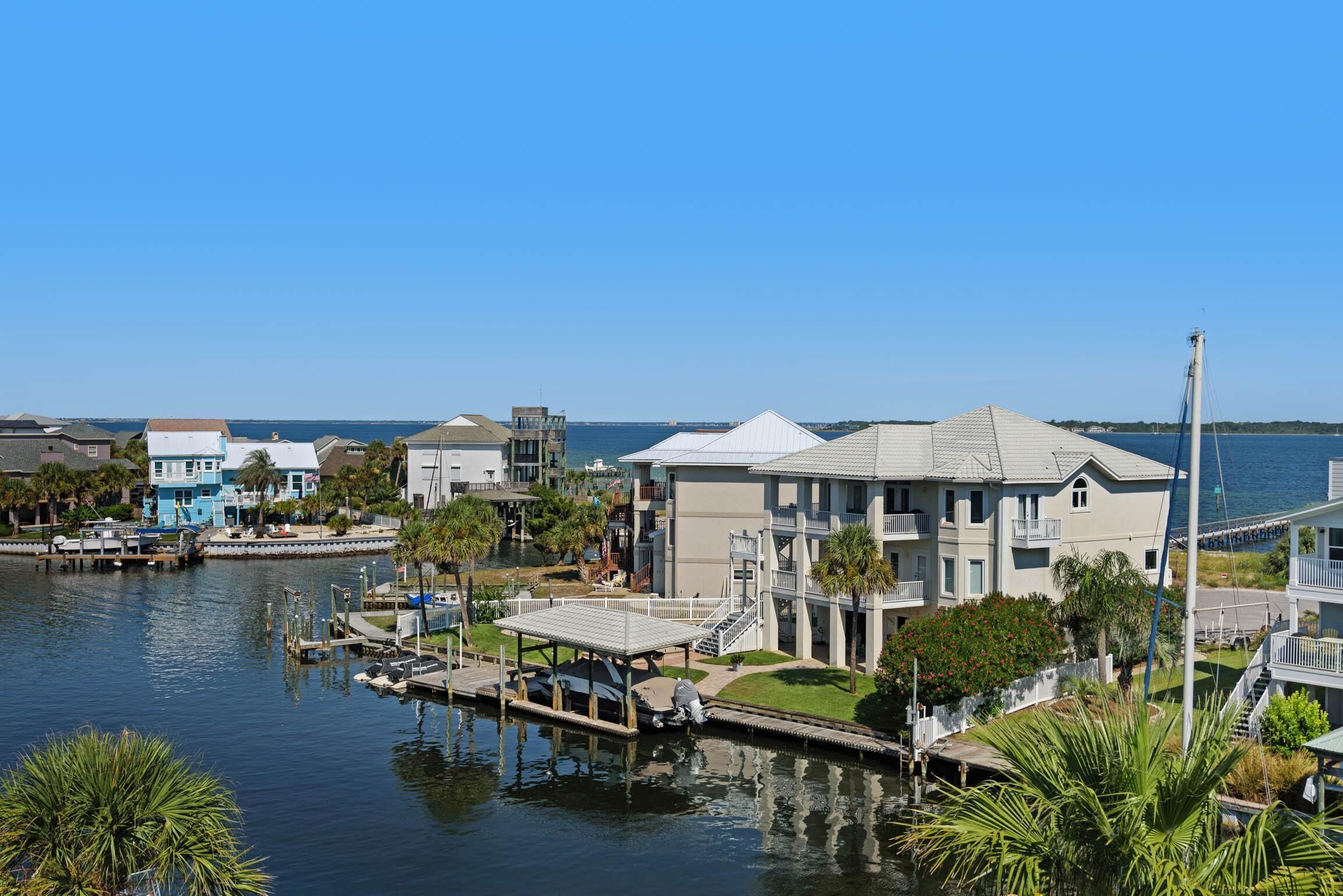 A waterfront property with multiple buildings, docks, and a marina.