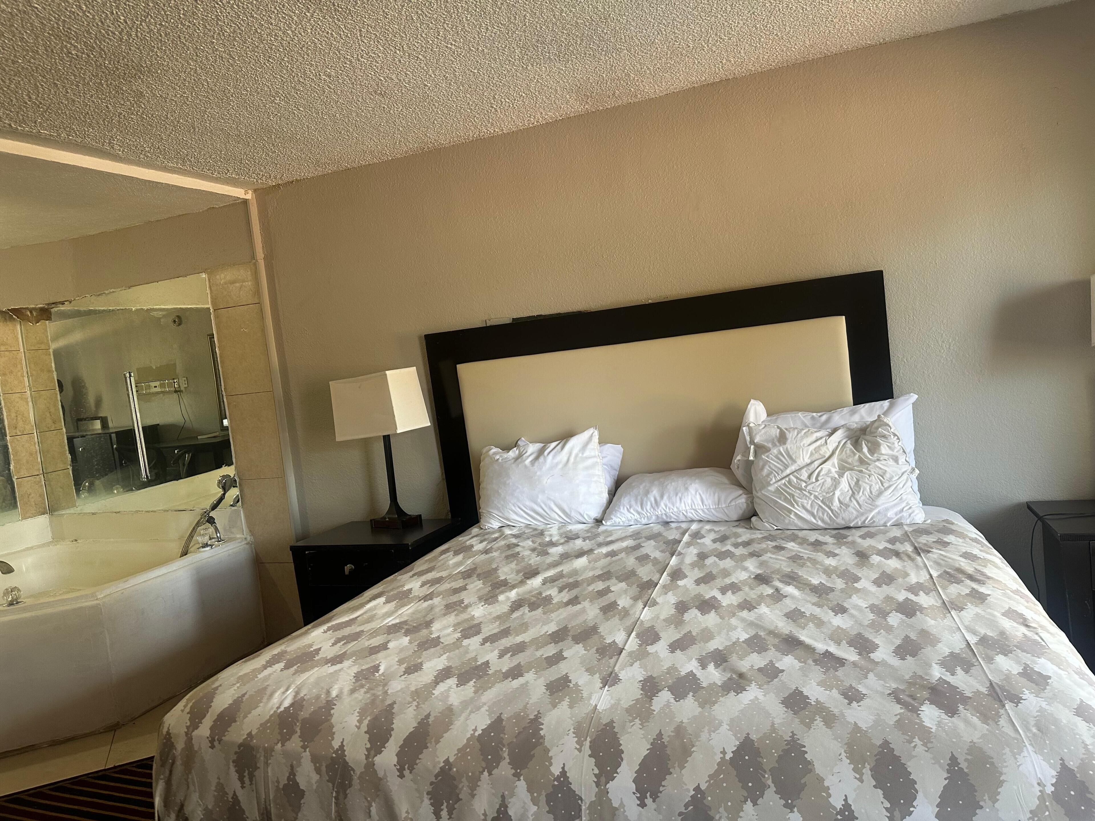 Room, 1 King Bed, Non Smoking, Jetted Tub | Desk, laptop workspace, blackout drapes, soundproofing