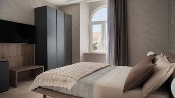 A bedroom with a bed, a wardrobe, a bench, a TV, and a window with curtains.