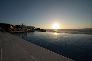 Outdoor pool, pool umbrellas, sun loungers