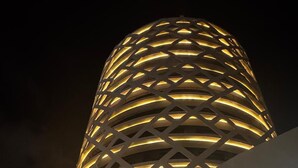 A modern building with a distinctive circular design and illuminated patterns. - Hotel Soho Boutique Casablanca (Casablanca)