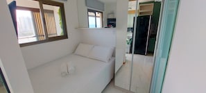 Apartamento básico | Wi-Fi de cortesia, roupa de cama