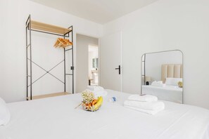 Departamento | 1 habitación, tabla de planchar con plancha y ropa de cama