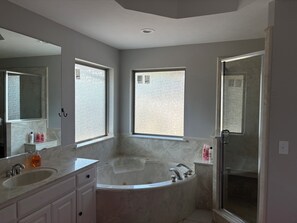 Jetted tub, hair dryer, towels, soap