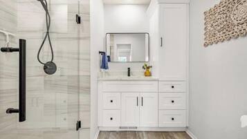Shower, hair dryer, towels, soap