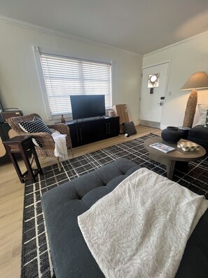 Unwind in a newly updated, beautifully furnished living room with coastal charm.