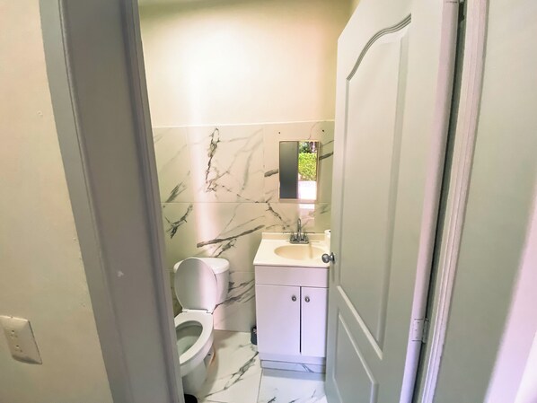 Shower, towels, soap, toilet paper