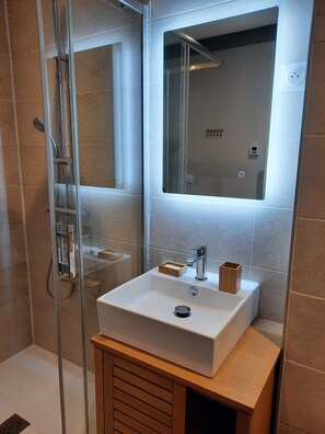 Shower, hair dryer, towels, soap