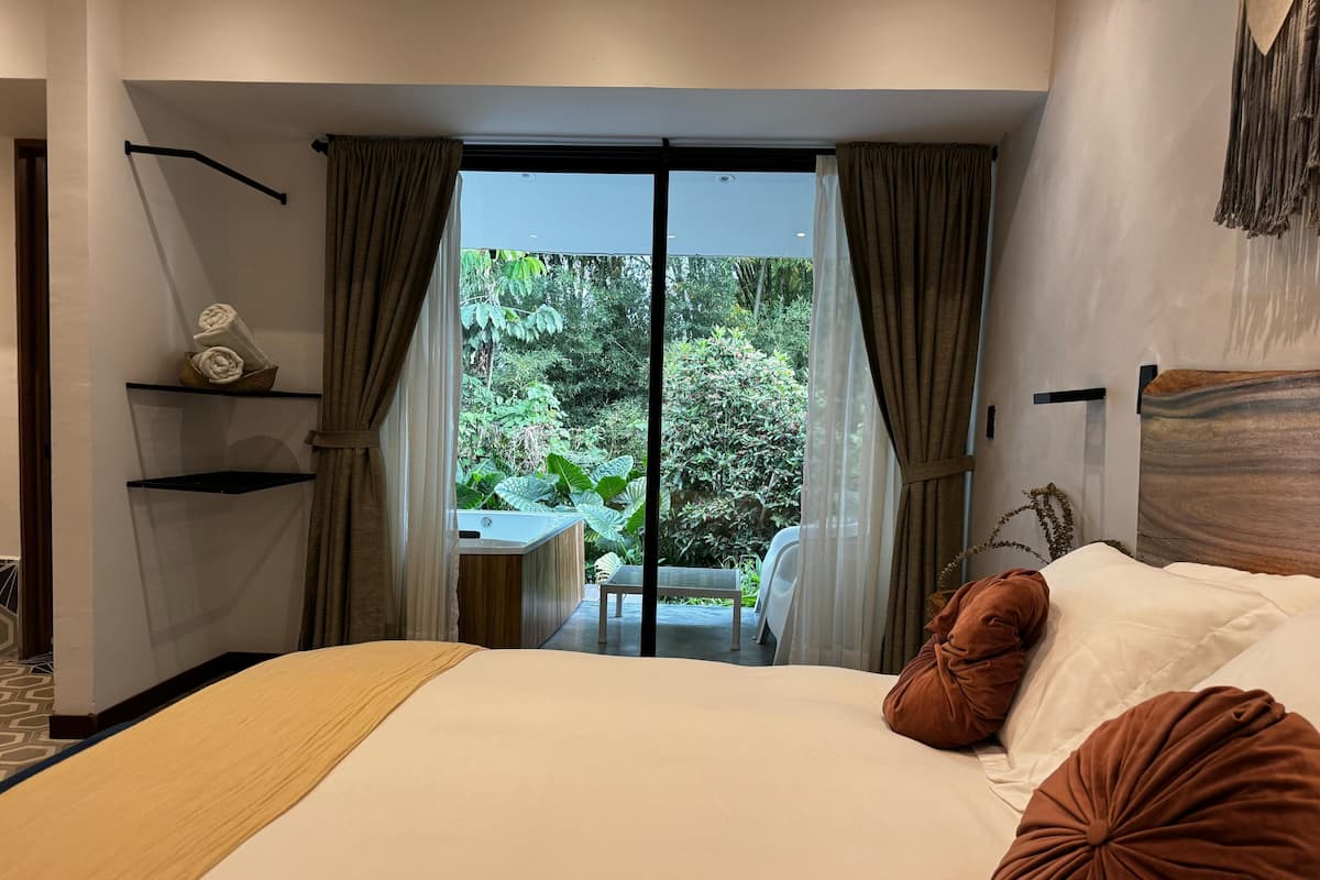 Deluxe Double Room, Garden View | Desk, laptop workspace, blackout drapes, iron/ironing board