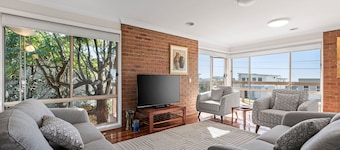 Coastal retreat with 3 bedrooms, studio, pool room and panoramic views.