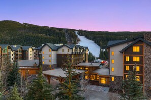 A resort with multiple buildings, a ski lift, and a mountain backdrop. - Premier 1-Bedroom in Keystone w/ Balcony & Views (Keystone)
