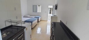 Comfort Suite, Balcony | Private kitchen | Mini-fridge, stovetop, cookware/dishes/utensils - Pousada Village Maitinga (Bertioga)