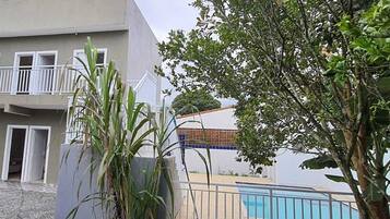 Suíte conforto, sacada | Terraço/pátio