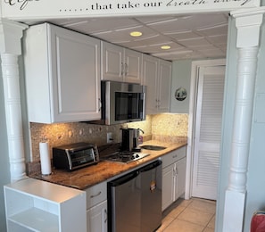 Fridge, microwave, stovetop, coffee/tea maker